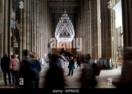 Visitors to Canterbury Cathedral in Kent, view an installation of 100 one metre tall baubles for their new exhibition, 'Under an Equal Sky' that will hang from the Nave ceiling, reflecting on themes of war and remembrance, migration and refugees and which coincides with 100 years since the end of the First World War. Stock Photo