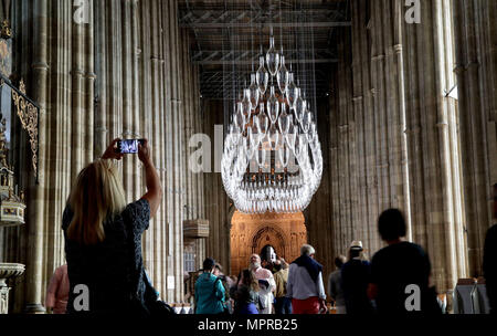 Visitors to Canterbury Cathedral in Kent, view an installation of 100 one metre tall baubles for their new exhibition, 'Under an Equal Sky' that will hang from the Nave ceiling, reflecting on themes of war and remembrance, migration and refugees and which coincides with 100 years since the end of the First World War. Stock Photo