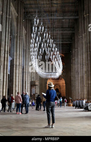 Visitors to Canterbury Cathedral in Kent, view an installation of 100 one metre tall baubles for their new exhibition, &Ocirc;Under an Equal Sky&Otilde; that will hang from the Nave ceiling, reflecting on themes of war and remembrance, migration and refugees and which coincides with 100 years since the end of the First World War. Stock Photo