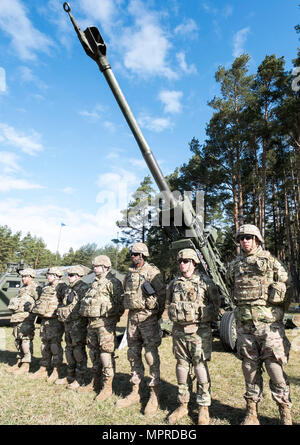 U.S. Army Soldiers stand by their howitzer static display during rehearsal for Battle Group Poland's welcome ceremony scheduled for April 13 near Orzysz, Poland.  The unique, multinational battle group, comprised of U.S., U.K., Romanian and Polish soldiers, will serve as a deterrence force in northeast Poland in support of NATO's Enhanced Forward Presence. (U.S. Army photo by Sgt. 1st Class Patricia Deal/Released)