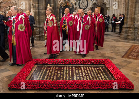 Knights of the Order of the Bath process past the grave of the Unknown Warrior during the Order of the Bath service at Westminster Abbey, London. Stock Photo
