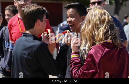 Torrey Pines High School students receive incentive items for participating in a bullying awareness session during an ASA Entertainment tour stop in San Diego, California on April 5, 2017. The archival image records a Marine Corps supported school outreach activity focused on youth education. Stock Photo