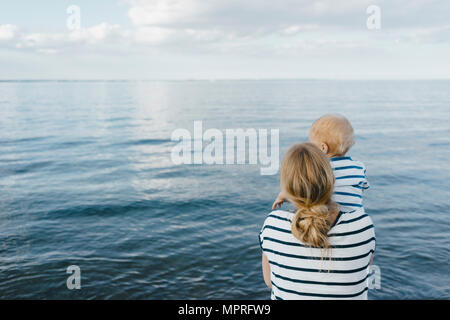 Germany, Timmendorfer Strand, mother holding his son