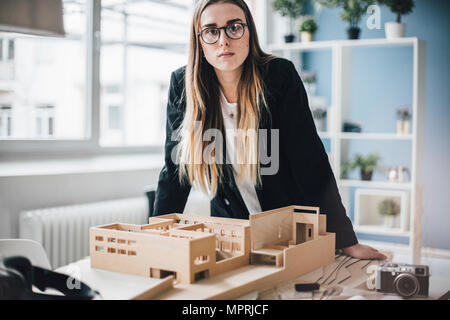 Portrait of architect with architectural model in office Stock Photo