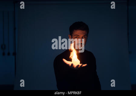 Portrait of magician with flame Stock Photo