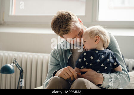 Father spending time with his son at home Stock Photo