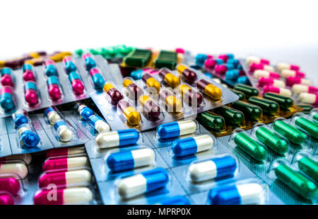 Colorful of antibiotic capsule pills isolated in blister pack isolated on white background with copy space. Antibiotic drug resistance. Pharmaceutical Stock Photo