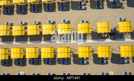 Bird's eye view of colored umbrella in a beach in italy, Tuscany,Viareggio Stock Photo