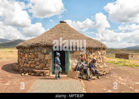 BLACK MOUNTAIN PASS, LESOTHO - MARCH 24, 2018: Unidentified Basotho people in front of a shop in the Mamokae village at the foot of the Black Mountain Stock Photo