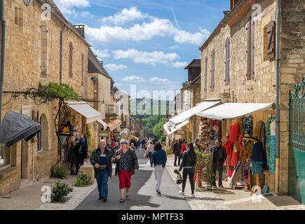 Shops on the Grand Rue in the historic old town of Domme, Dordogne, France Stock Photo