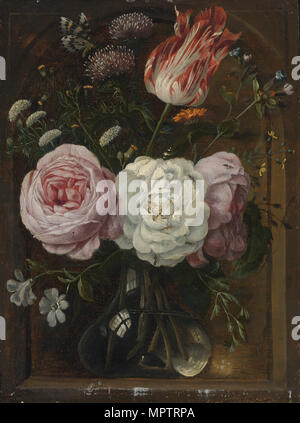 Flower still life with a tulip and roses in a glass vase. Stock Photo