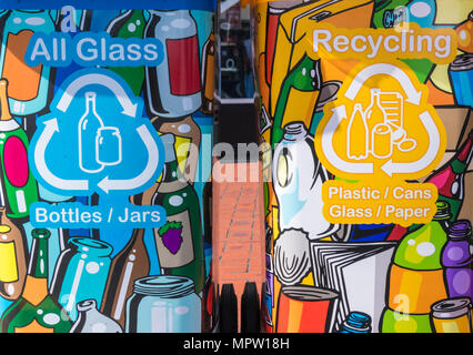 colourful decorated bright eye catching recycling bins in a row in a town centre Stock Photo