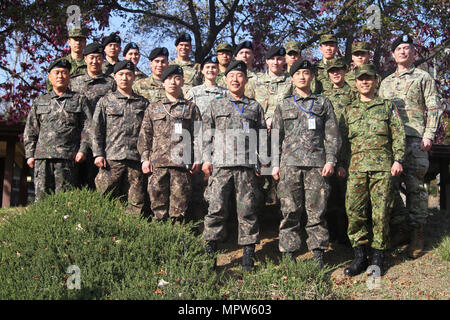 Service members from the Republic of Korea, Japan and the United States pose for a photo during the trilateral symposium at Yongsan Garrison, April 12. The purpose of the trilateral symposium is to extend and share information on officers’ leadership, duties and responsibilities and to shape and foster a better relationship for future endeavors. (US Army Stock Photo