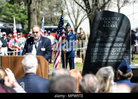 Jeff Thatcher, son of Doolittle Raider, Staff Sgt. David Thatcher, gives remarks at the National Museum of the United States Air Force April 18, 2017. The memorial service, including a wreath laying, honored the 75th anniversary of the Doolittle Tokyo Raid in which 80 volunteers used 16 B-25 bombers to strike the Japanese mainland from the USS Hornet aircraft carrier, turning the tide of World War II. The ceremony included two flyovers of B-25 bombers, one in the missing man formation, and a B-1B bomber flyover, one of which had been rechristened the 'Ruptured Duck' in a ceremony the day befor Stock Photo