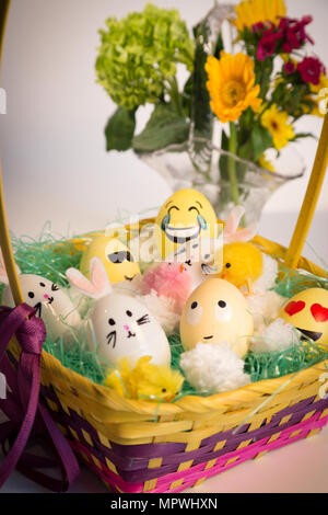 Basket of Hand Decorated Easter Eggs and Bunnies, USA Stock Photo