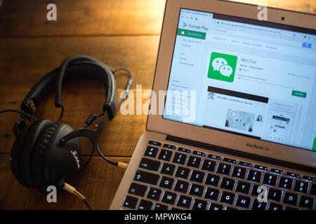 The WeChat application seen displayed on a Apple MacBook Air computer monitor via the Google Play Store. Stock Photo