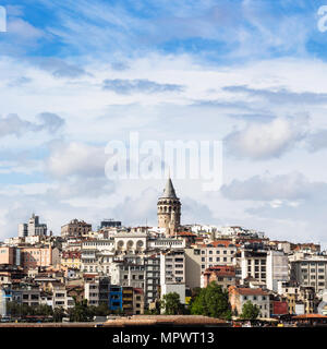 Travel to Turkey - view of Galata (Karakoy) District over Golden Horn bay in Istanbul city in spring Stock Photo