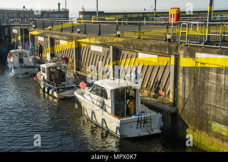 Small,boats in one of the locks which are part of the Cardiff Bay barrage. The locks enable boats to enter and exit the Bristol Channel. Stock Photo