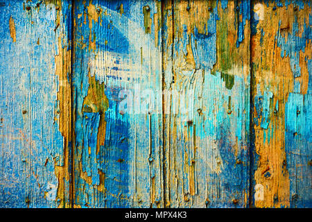 Old wooden boards with flaking blue paint, may be used as background Stock Photo