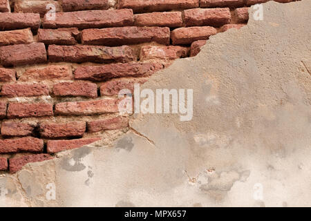 Background of old brick wall cracked. Stock Photo