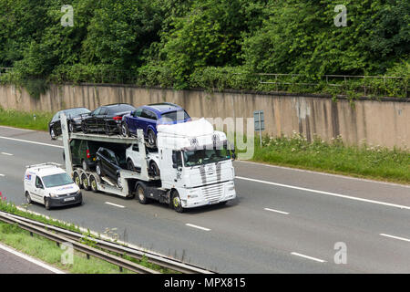 AIC Transport Ltd car transporter with Daf XF105 tractor unit travelling on the M61 motorway  near Farnworth, Stock Photo