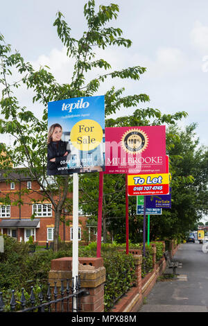 Property for sale and to let signs from a variety of estate agents outside a block of modern apartments, Hatherton Court, Worsely Road North, Walkden, Stock Photo