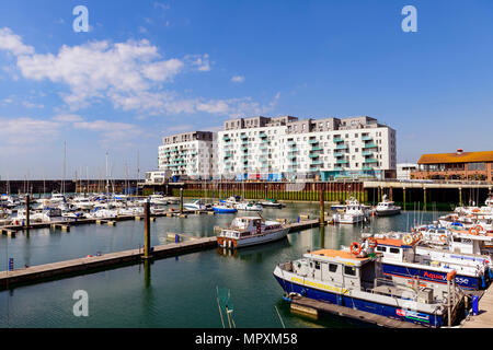 moored yachts and apartments, Brighton marina, Sussex UK Stock Photo