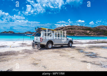 Hellfire Bay, Esperance, Australia--February 9, 2018. Truck carrying surfboards on roof is parked on the beach at Hellfire Bay in Esperance, Australia Stock Photo