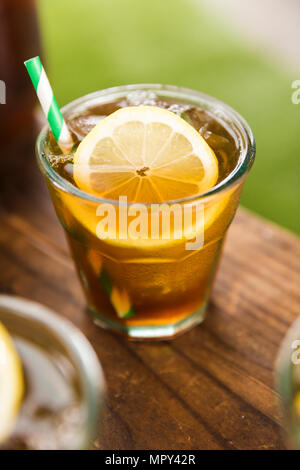Close-up of ice tea with lemon slice on table Stock Photo