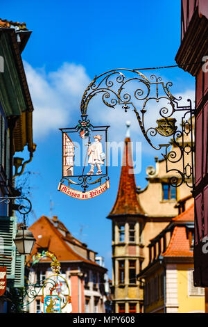 Old metal sigh board in historical center of Colmar, Alsace, France Stock Photo