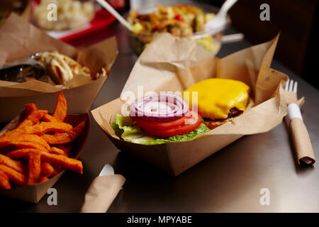 High angle view of burger with French fries on table Stock Photo