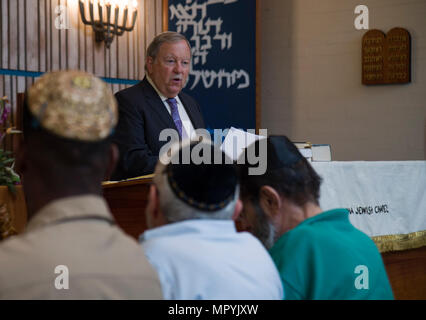 170424-N-WC566-0026 PEARL HARBOR (April 24, 2017)  A Bender, volunteer lay leader at the Aloha Jewish Chapel, tells stories of heroism during the Holocaust to military and civilian observers during a Holocaust Remembrance Ceremony held at Joint Base Pearl Harbor-Hickam. This year’s theme is, “The Strength of the Human Spirit”, and featured Dr. Bender as the guest speaker. (U.S. Navy Photo by Mass Communications Specialist 2nd Class Gabrielle Joyner) Stock Photo