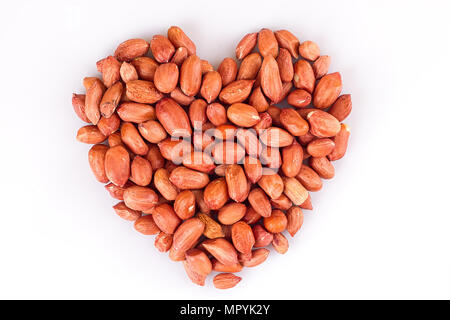 Peanuts in heart symbol isolated on white Stock Photo