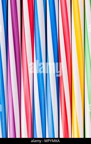 Background stripes multicolored smoothies plastic cocktail straws Stock Photo
