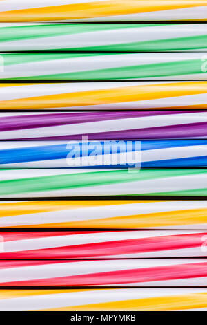 Background stripes multicolored smoothies plastic cocktail straws Stock Photo