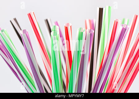 Colorful cocktail tubes in a glass cup Stock Photo