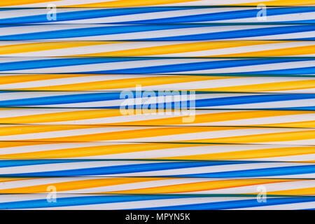 Background stripes multicolored smoothies plastic cocktail straws Stock Photo