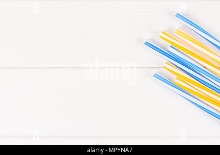 Multicolor cocktail tubes on white background. Close up Stock Photo
