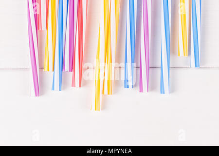 Multicolor cocktail tubes on white background. Close up Stock Photo