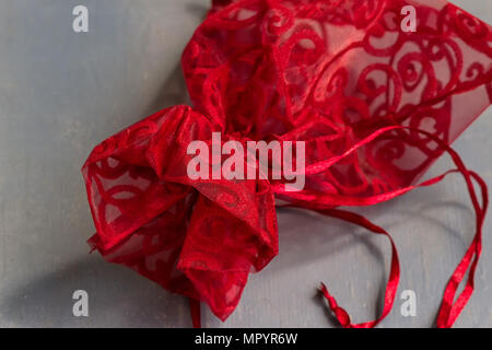 Red drawstring bag On a gray-blue background Stock Photo