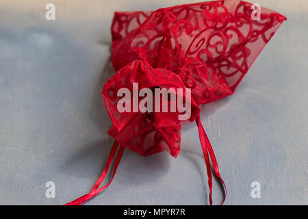 Red drawstring bag On a gray-blue background Stock Photo