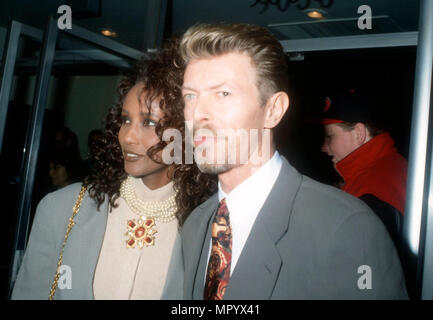 BEVERLY HILLS, CA - MARCH 5: (L-R) Model Iman and singer/musician David Bowie attend the premiere of 'La Femme Nikita' on March 5, 1991 at the Music Hall Theater in Beverly Hills, California. Photo by Barry King/Alamy Stock Photo Stock Photo