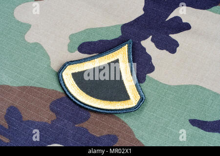 KIEV, UKRAINE - June 6, 2015.  US ARMY Private First Class rank patch on woodland camouflage uniform Stock Photo