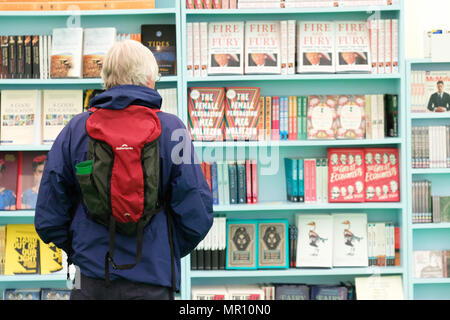 Hay Festival, Hay on Wye, UK - May 2018 - A visitor browses the books on sale in the Hay Festival bookshop  - Photo Steven May / Alamy Live News Stock Photo