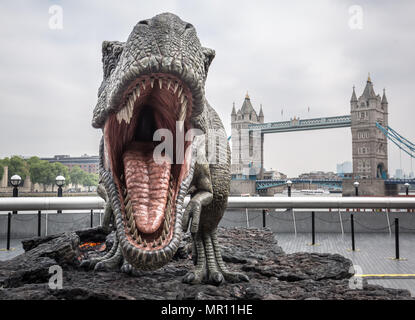 London, UK. 25th May 2018. A model Tyrannosaurus Rex at London Bridge promotes 'Jurassic World: Fallen Kingdom' film opening. Credit: Guy Corbishley/Alamy Live News Stock Photo