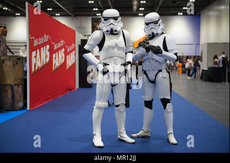 ExCel, London, UK. 25 May, 2018. Cosplayers descend on ExCel for the huge Comic Con weekend featuring gaming, superheroes, Star Wars, comics and TV and Film zones. Imperial Star Wars troops herd visitors to the main entrance gates in ExCel. Credit: Malcolm Park/Alamy Live News. Stock Photo