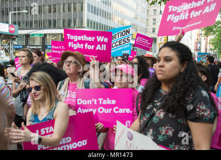 New York, USA. 24th May 2018. Supporters with signs at a Title X (Title Ten) gag rule rally in New York City, hosted by Planned Parenthood of New York City on May 24th 2018, reacting the President Trump's attempt to ban Medicaid and federal funding to medical providers who provide full, legal medical information to patients wanting or needing abortion services. Credit: Brigette Supernova/Alamy Live News Stock Photo