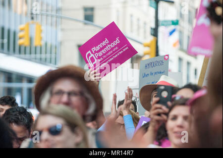 Supporters with protest signs at Title X (Title Ten) gag rule rally in New York City, hosted by Planned Parenthood of New York City on May 24th 2018, reacting the President Trump's attempt to ban Medicaid and federal funding to medical providers who provide full, legal medical information to patients wanting or needing abortion services. Stock Photo