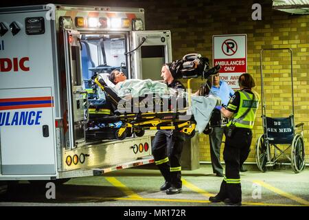 Mississauga, CAN., 24 May 2018. 24th May, 2018. Victims of the bombing at Bombay Bhel arrive at Sunnybrook Trauma Centre. Fifteen people were rushed to hospital, 3 in critical condition, after a bomb exploded in a Mississauga, Canada, Indian Restaurant. The explosion happened around 10:30 PM in the Toronto suburb, west of the city. Police are searching for two suspects. Credit: Victor Biro/ZUMA Wire/Alamy Live News