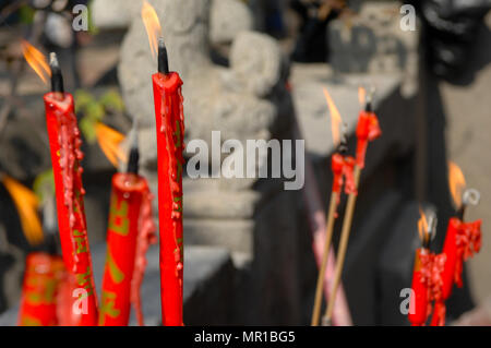 Red candles burning in the temple A-Ma in Macao, China. Stock Photo